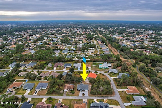 birds eye view of property with a residential view