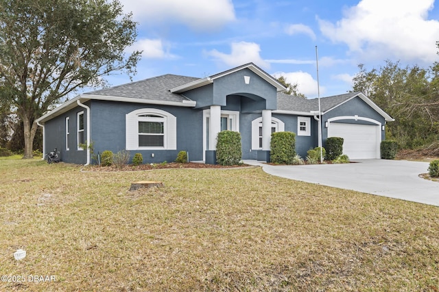 ranch-style house featuring a garage, driveway, roof with shingles, stucco siding, and a front yard