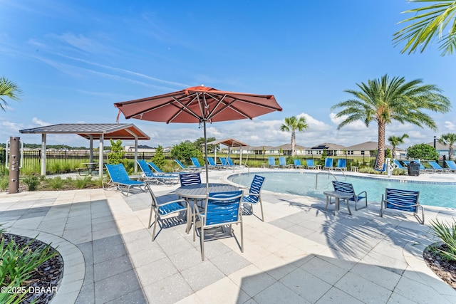 view of patio / terrace featuring a community pool