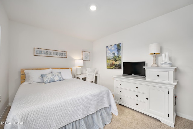 bedroom with recessed lighting, light colored carpet, and baseboards