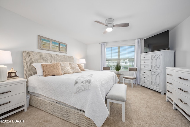 bedroom featuring a ceiling fan and light colored carpet