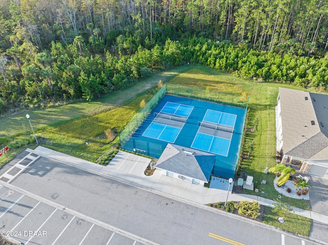 birds eye view of property with a forest view