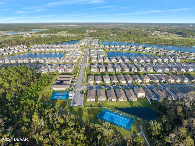 drone / aerial view with a residential view and a water view