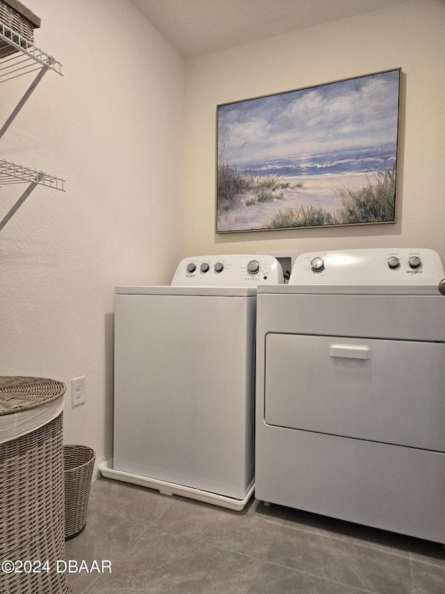 laundry room with washer and clothes dryer and laundry area