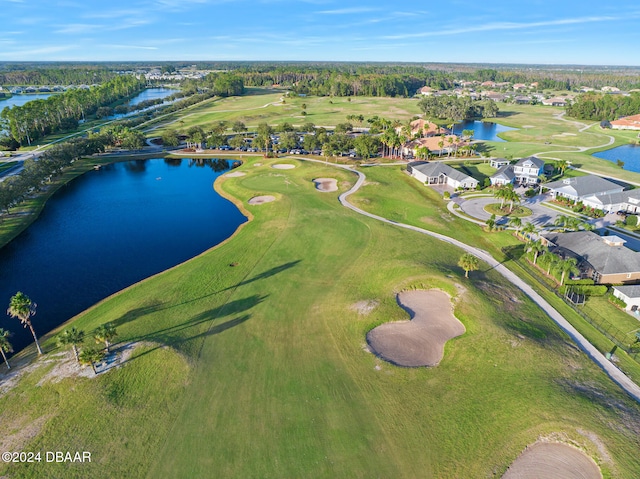 bird's eye view with a water view and golf course view