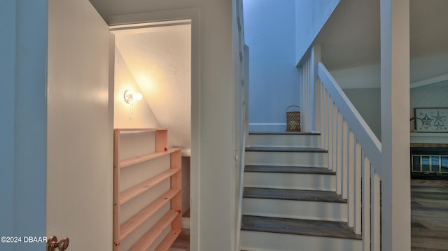 stairway featuring hardwood / wood-style floors