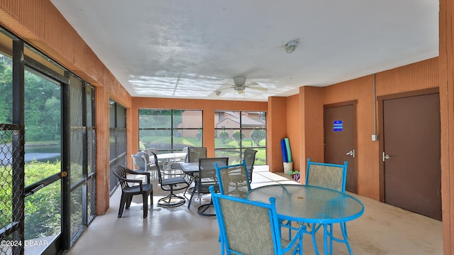 sunroom / solarium featuring ceiling fan