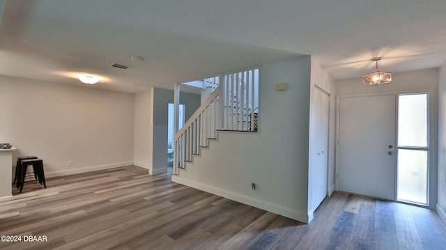 entrance foyer featuring hardwood / wood-style flooring