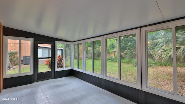 unfurnished sunroom featuring a wealth of natural light and lofted ceiling