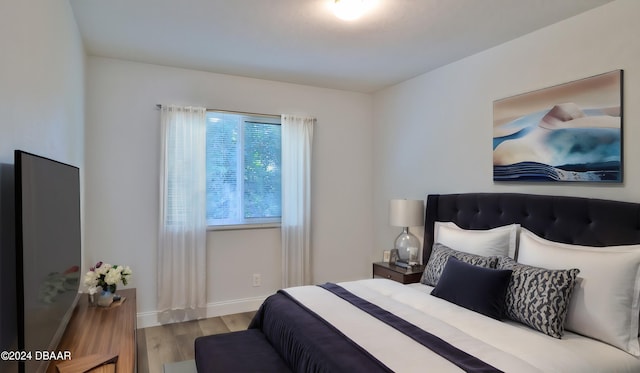 bedroom with light hardwood / wood-style flooring