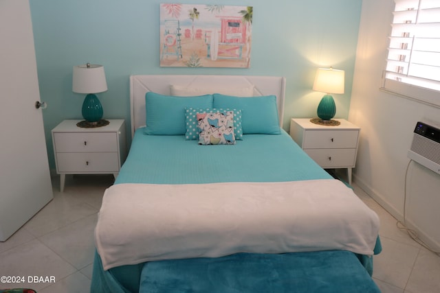 bedroom with light tile patterned floors