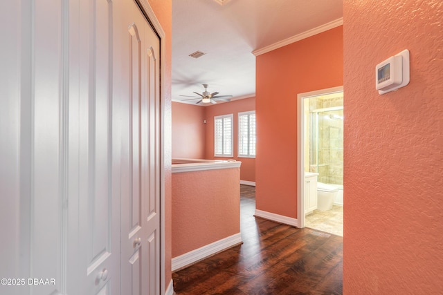 20 Promenade At Lionspaw, Daytona Beach, FL 32124 - corridor with dark wood finished floors, a textured wall, baseboards, and ornamental molding