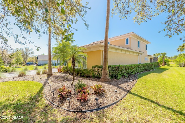 20 Promenade At Lionspaw, Daytona Beach, FL 32124 - view of property exterior with a yard and stucco siding