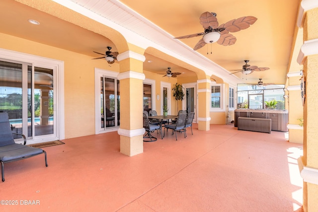 20 Promenade At Lionspaw, Daytona Beach, FL 32124 - view of patio / terrace featuring outdoor dining area, a ceiling fan, and a hot tub