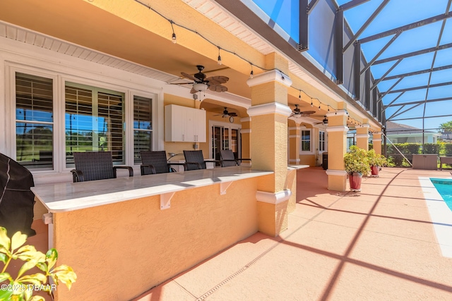 20 Promenade At Lionspaw, Daytona Beach, FL 32124 - view of patio / terrace featuring an outdoor pool, glass enclosure, outdoor dry bar, and a ceiling fan