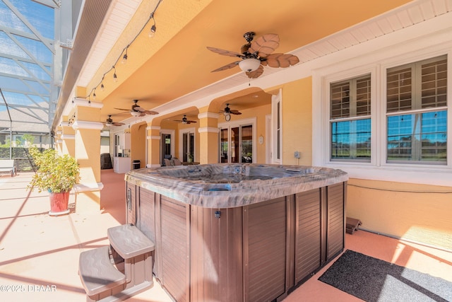 20 Promenade At Lionspaw, Daytona Beach, FL 32124 - view of patio / terrace with glass enclosure, a hot tub, and ceiling fan