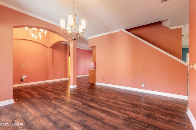 20 Promenade At Lionspaw, Daytona Beach, FL 32124 - unfurnished room featuring baseboards, arched walkways, dark wood-style flooring, and a chandelier