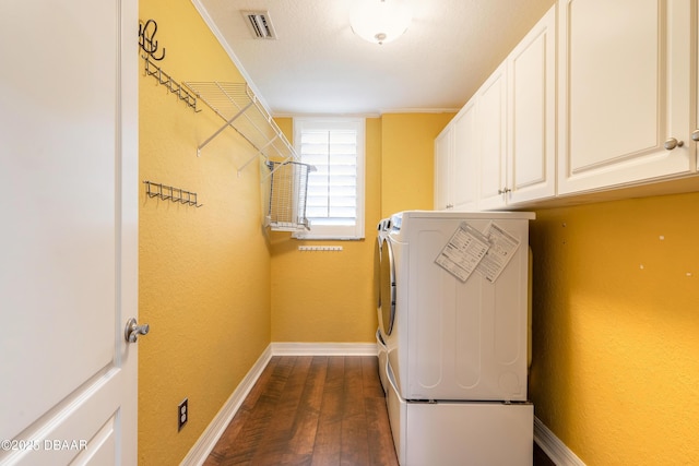 20 Promenade At Lionspaw, Daytona Beach, FL 32124 - washroom featuring washer and dryer, dark wood-type flooring, cabinet space, and baseboards