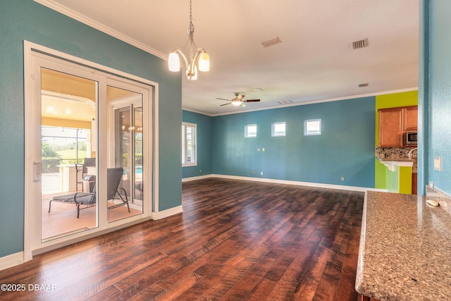 20 Promenade At Lionspaw, Daytona Beach, FL 32124 - spare room featuring visible vents, ceiling fan with notable chandelier, crown molding, and dark wood-style flooring