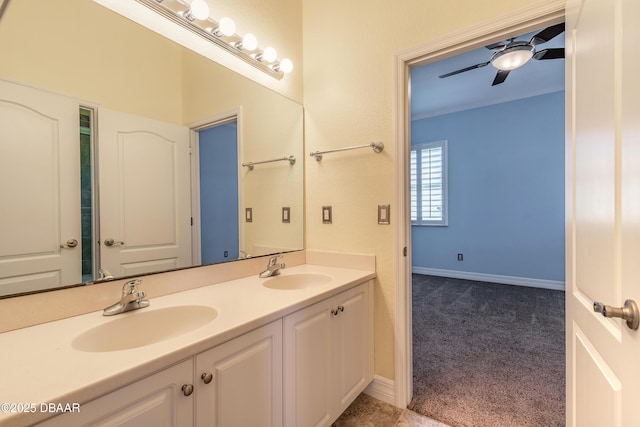 20 Promenade At Lionspaw, Daytona Beach, FL 32124 - bathroom featuring ceiling fan, double vanity, baseboards, and a sink