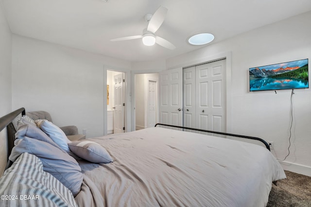 bedroom featuring ceiling fan, carpet flooring, and a closet