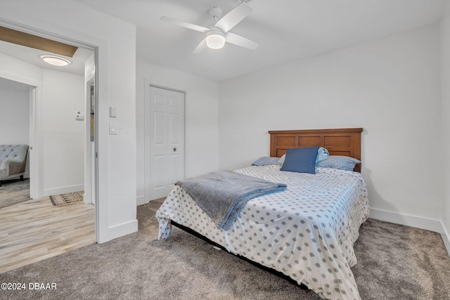 bedroom featuring hardwood / wood-style floors and ceiling fan