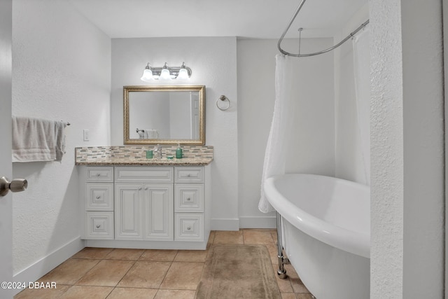 bathroom featuring tasteful backsplash, vanity, tile patterned flooring, and shower with separate bathtub