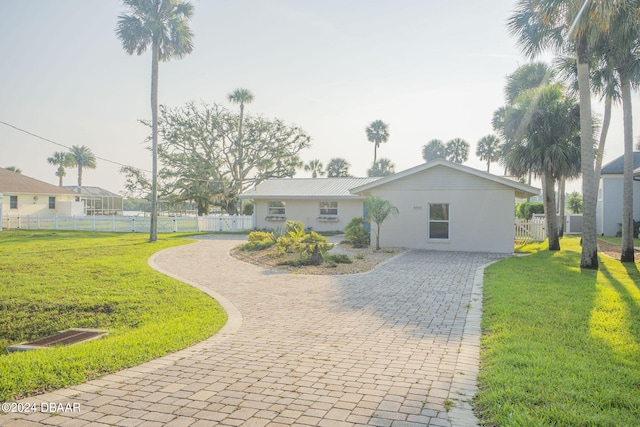 ranch-style house featuring a front lawn