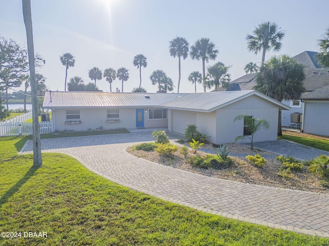 ranch-style home with a front yard