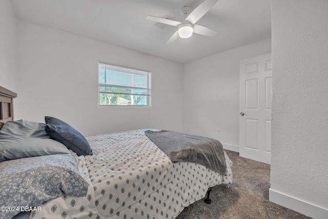 bedroom with ceiling fan and carpet floors