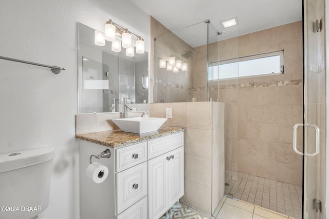 bathroom with walk in shower, tile patterned flooring, vanity, and toilet