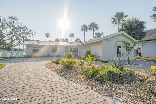 single story home with a garage