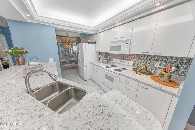 kitchen featuring sink, tasteful backsplash, light stone countertops, white appliances, and white cabinets