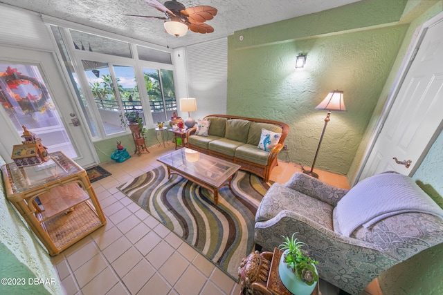 tiled living room featuring a textured ceiling and ceiling fan