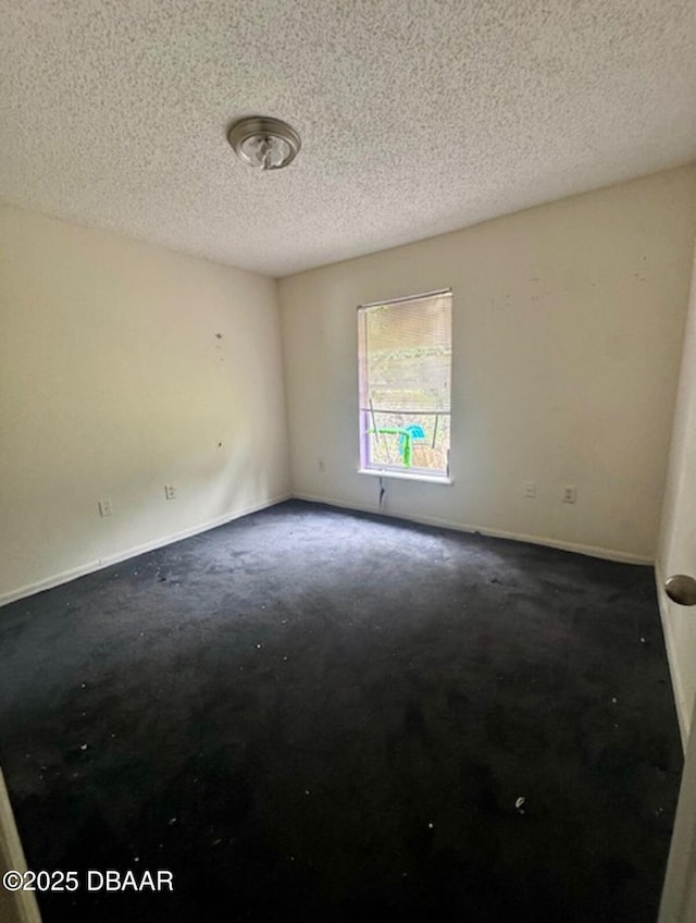 1362 Comerwood Dr, Deltona, FL 32738 - empty room featuring a textured ceiling and baseboards