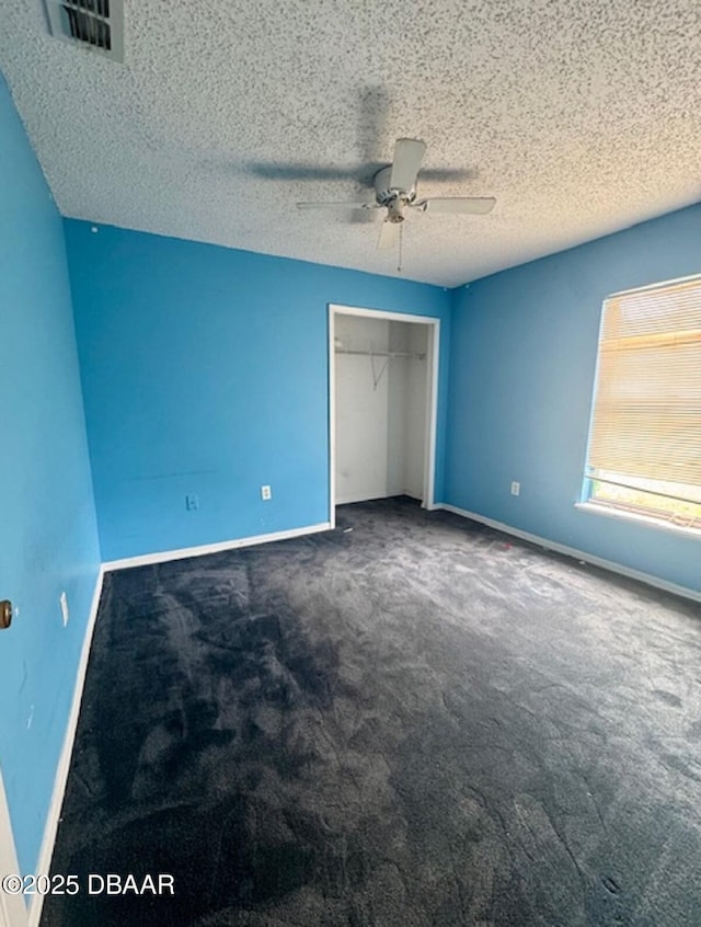1362 Comerwood Dr, Deltona, FL 32738 - unfurnished bedroom featuring carpet floors, a closet, a ceiling fan, and a textured ceiling