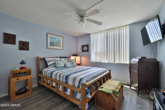 bedroom with dark wood-type flooring and ceiling fan