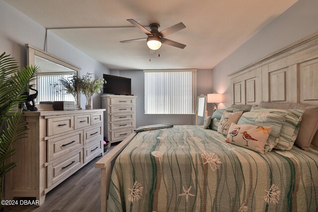 bedroom with ceiling fan and dark hardwood / wood-style floors