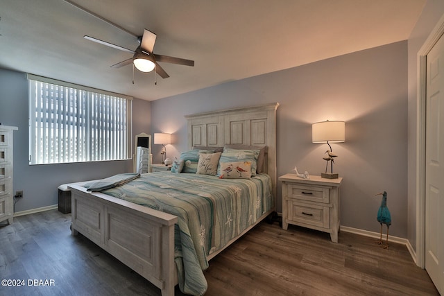 bedroom featuring dark hardwood / wood-style flooring and ceiling fan