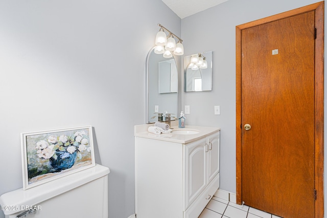 bathroom featuring tile patterned floors, vanity, and toilet