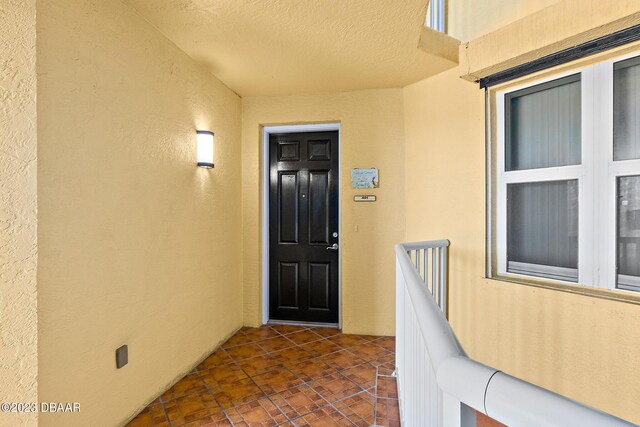 entrance to property with stucco siding