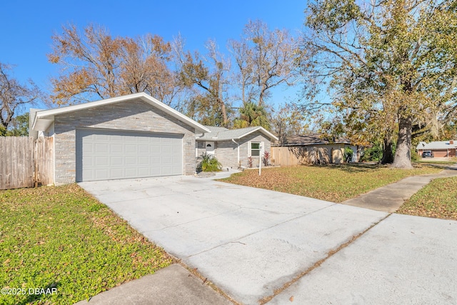 single story home with a garage and a front lawn