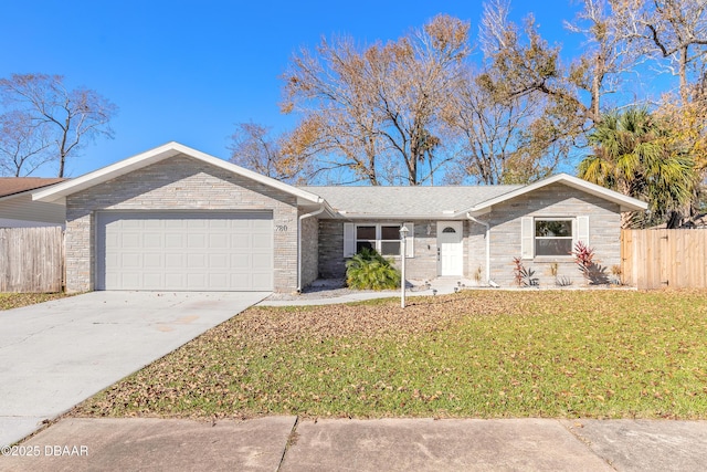 ranch-style house with a front yard and a garage