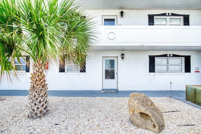 doorway to property featuring a patio