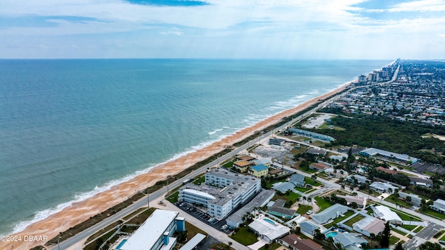 drone / aerial view with a beach view and a water view