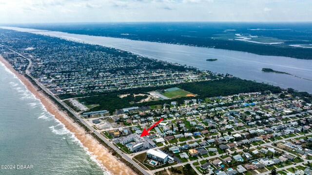 aerial view with a view of the beach and a water view