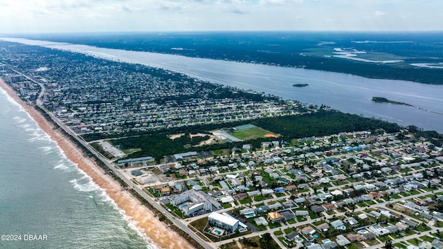 bird's eye view with a water view and a view of the beach