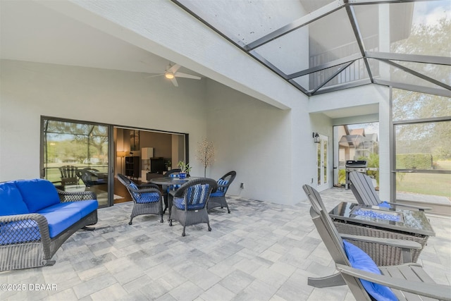 exterior space featuring an outdoor living space, area for grilling, a lanai, and ceiling fan