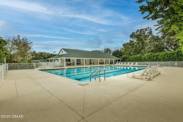 view of swimming pool with a patio