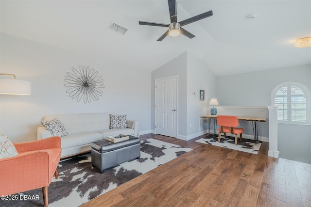 living room featuring hardwood / wood-style flooring, ceiling fan, and vaulted ceiling